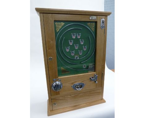 A REPRODUCTION '9-CUP' ALLWIN STYLE SLOT MACHINE, in pine case, green baize backed interior, 10p per game