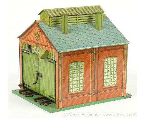 Hornby O Gauge No.1 Engine Shed.  Some fading to one side and litho loss to one door, the shed is fitted with electric lighti