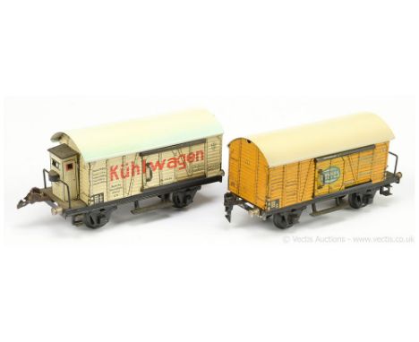 Marklin O Gauge a pair of Continental Advertising Wagons consisting of Ref 17930 Kuhlwagen in white with red lettering, sides