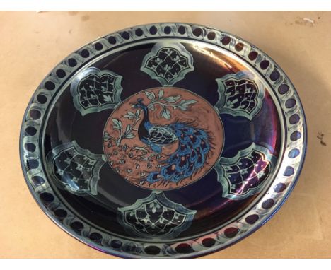A Hege Jonathan Chiswell Jones Peacock lustre charger. 39cm diameter