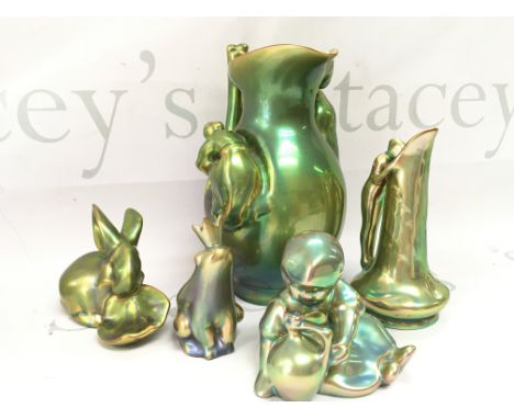 A collection of Zsolnay Pecs lustre glazed pottery Figures and a jug. This lot cannot be posted