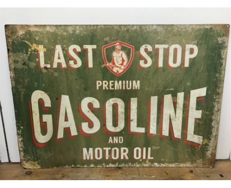 A vintage Last Stop Premium gasoline and motor oil enamel sign , 70cm wide 50cm tall