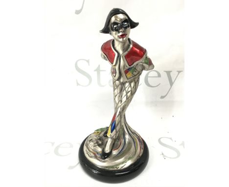 A sterling silver overlaid figure of a traditional Italian Arlecchino. Signed Midas. 25cm tall Postage category B