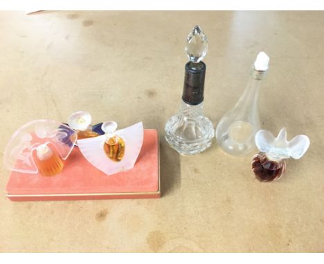 A Rene Lalique St Odile fruit liqueur bottle miniature early 1920s together with Lalique miniatures perfume bottles and early