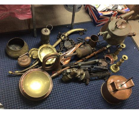 A good collection of antique metal ware copper and brass including miners lamp car lamp gin traps horse harness copper pots b