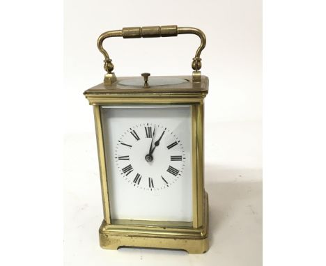 A French brass cased strike repeat carriage clock with a white enamel dial Hight 13cm