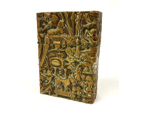 An antique C.1930s pressed brass cased lighter decorated with Egyptian symbols. 6cm. (A) NO RESERVE