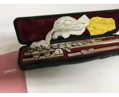 A Yamaha chrome finish flute in a fitted case good condition.