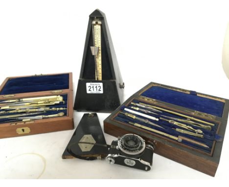 A Swiss made Metronome two cased sets of vintage architects drawing instruments and a Vintage miniature ELJY Lumiere camera (