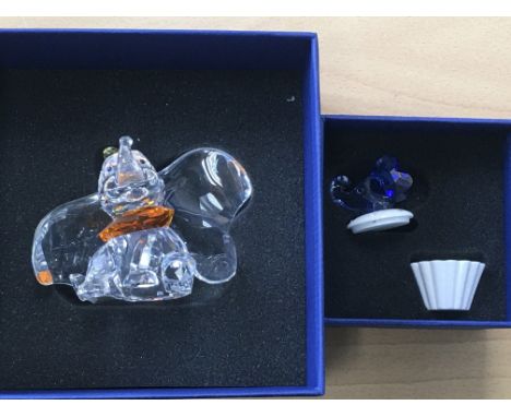 A Boxed Swarovski Disney figure of Dumbo, together with a trinket box with an blue coloured elephant head on the lid