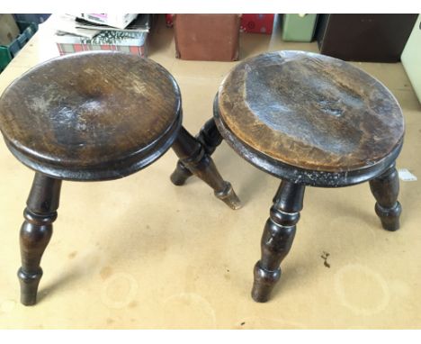 A three legged milking stool 8.5" tall and a four legged milking stool 7.5" tall. Postage C