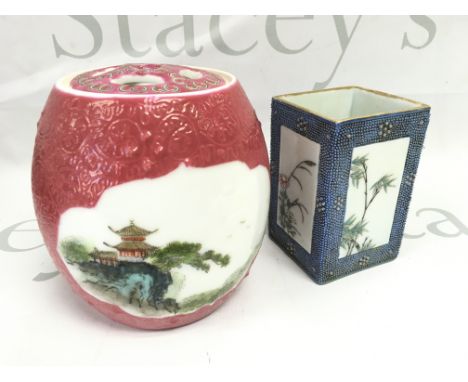 A Chinese Famille Rose brush pot with painted floral design panels ,surrounded by a light blue chicken skin ground and a red 