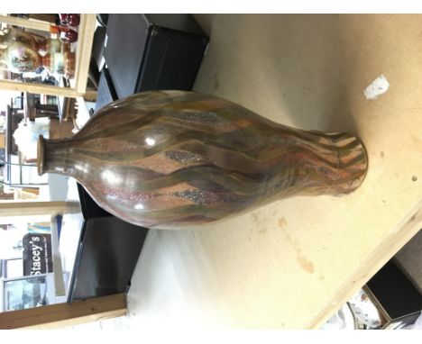 Sutton Taylor Cinnabar earthware bottle covered in lustred polychrome flame like decoration. Impressed ST and LH for Lotherto