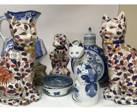A collection of ceramics a large Masons blue and white jug 20th Century Chinese cat and monkey figures and other ceramics.