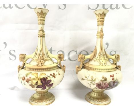 A pair of Royal Worcester vases with floral decoration and goats heads handles and a pair of Worcester shell dishes . This lo
