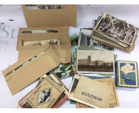 A collection of vintage UK postcards, some world and a pack of Panama souvenir playing cards made in USA . Postage category A