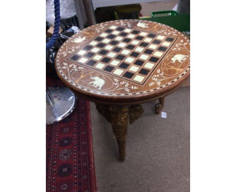 A inlaid occasional table with game board inset in mother of pearl.