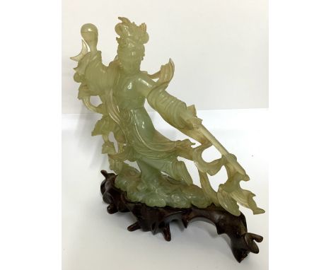 A 20thC carved Jade figure of a Chinese warrior princess holding a pearl and sword. (D)