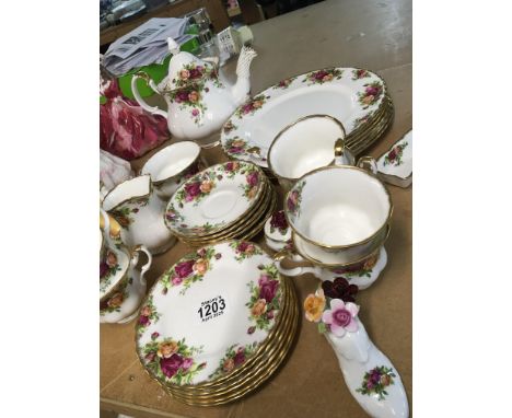 A Royal Albert Old English Country Rose pattern tea and dinner set a six place tea set with tea pot cream jug and sugar bowl 