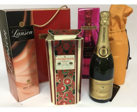 A collection of Champagne Piper Heidsiek Lanson and others. A bottle of Courvoisier VS Cognac.