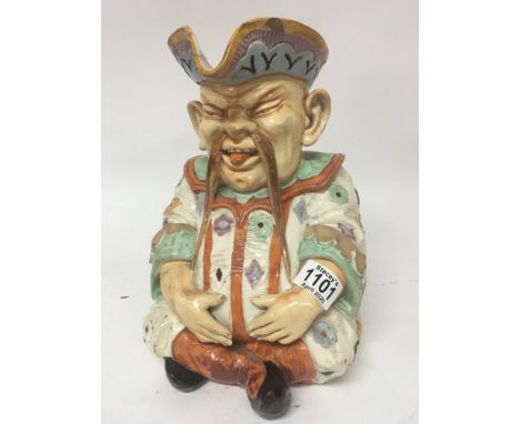 A large Victorian Majolica caricature jug in the form of a seated oriental man marks to the base W & R L 3. Height 30cm some 
