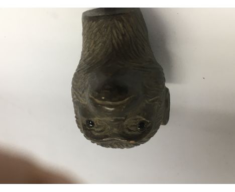 A walking stick handle in the form of a monkeys head . NO RESERVE