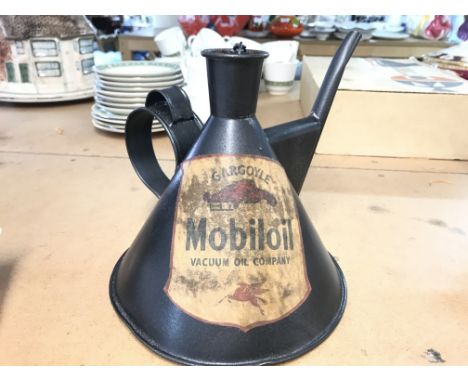 A vintage unusual shaped oil can possibly used to add oil to the pistons in the S.U carbs Mobil oil label . 18cm tall postage