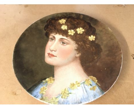Moore & Co late 19th century charger in the arts and crafts style decorated with a hand painted portrait of a lady with a yel