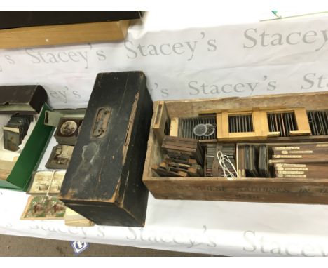 A magic lantern projector and a large number of assorted slides.