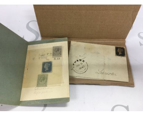 A small assortment of stamps including a penny black and a 2p blue stamp.