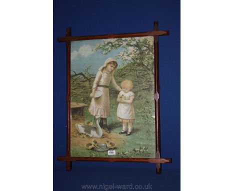 A cruciform pitch Pine framed Pears Print of two young girls feeding geese. 17'' x 23 1/2''