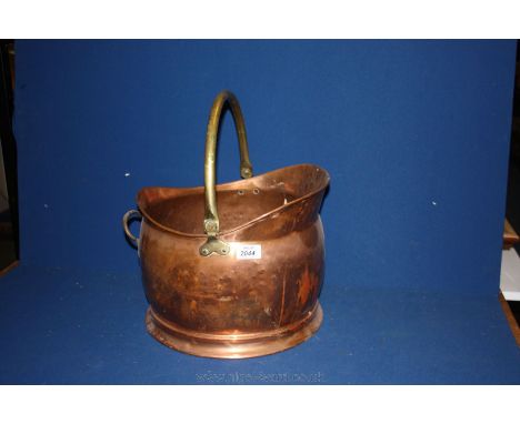 A large Copper helmet shaped Coal Scuttle. 