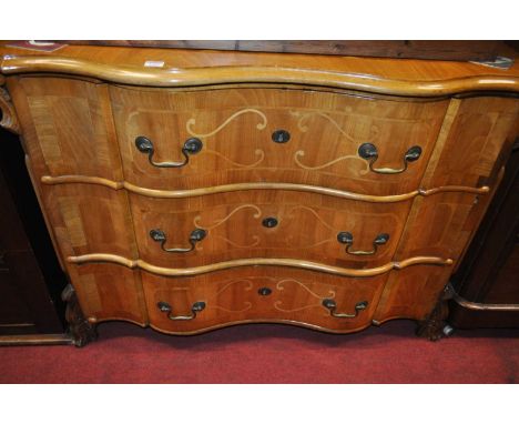 A 19th century Continental walnut and inlaid serpentine front commode chest of three long drawers, width 113cm