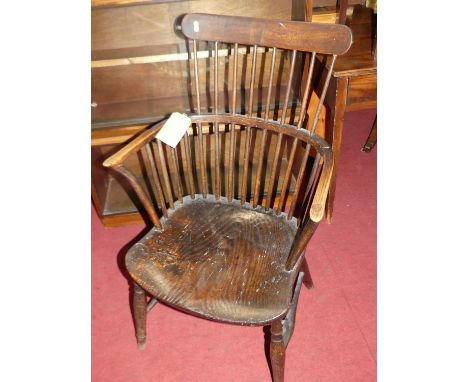 A 19th century provincial elm and beech comb back Windsor chair, width 55cmSeat height 40cm. Chair sits well, and is good and