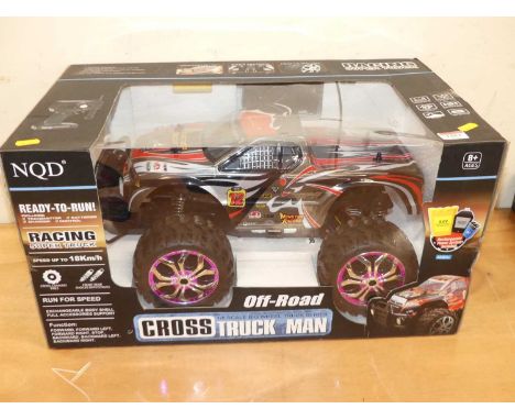 An NQD radio controlled off-road cross truck, large scale example, housed in the original window display box: Appears unused 