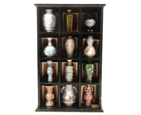 Franklin Porcelain, The Treasures of the Imperial Dynasties, a miniature set of replica vases, in wooden wall shelf.Condition