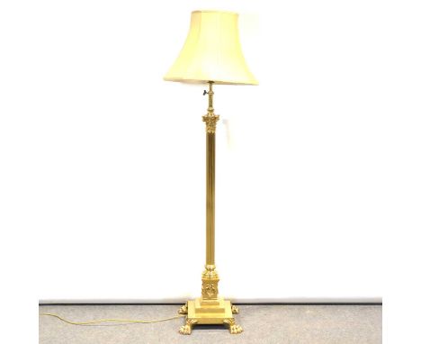 Brass standard lamp, height adjustable Corintian column, square base with paw feet, with shade, minimum overall height 175cm.