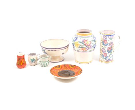 Seven pieces of Poole pottery, to include two Delphis pattern items; a pedestal comport, plain ground with floral motifs, pur