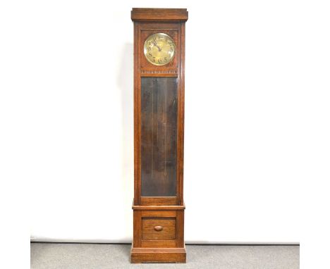 1930's oak longcase clock, circular dial, glazed door, the movement striking on gongs, height 215cm.