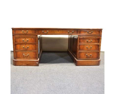 Reproduction mahogany twin pedestal partner's desk, leather top, one side with drawers and slides, the other with drawers and