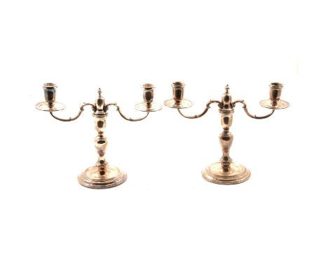 Pair of silver two light candelabra, C J Vander, London 1966, each with two sconces on scrolled branches, circular base, 20.5