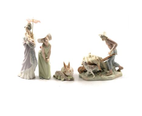 Eight Lladro figurines: Lady with parasol (Damita Milanesa) no. 5323; Girl with rabbit; Girl carrying flower pot (daisa); Gir