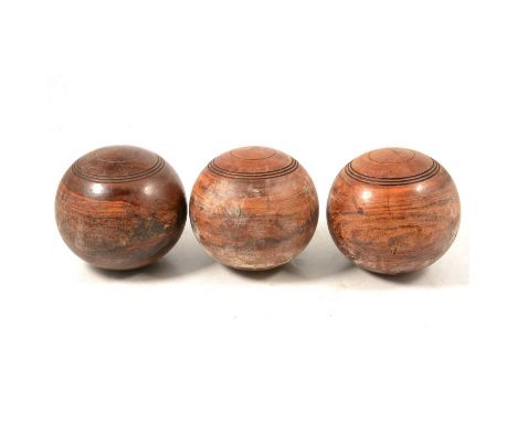 A collection of wooden lawn bowls/ woods, and carry bags (Ivory markers removed)Condition report:There are 17 in the lot. The