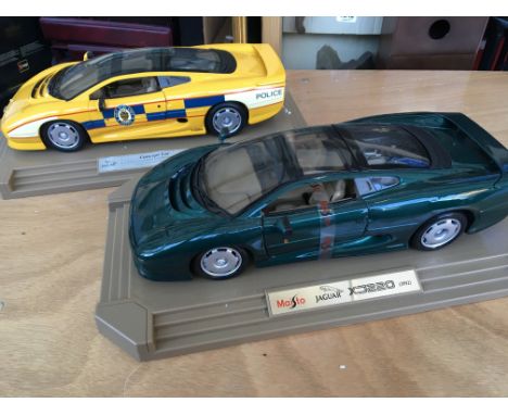 Maisto Jaguar XJ220, 1:12 scale with stand and boxed and a Jaguar XJ220concept car hand finished limited edition , boxed