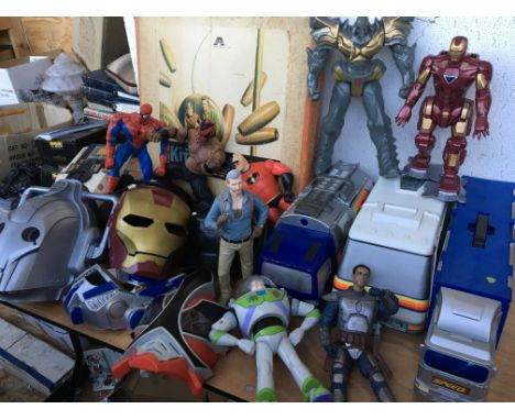 A box containing large action figures including Spider-Man and masks including Darth vader, Iron man etc and micro machine ca