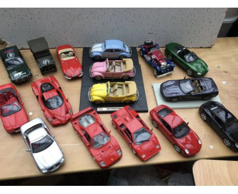 A collection of loose large 1:18 scale diecast vehicles including, Burago, ERTL, Maisto, Solido etc