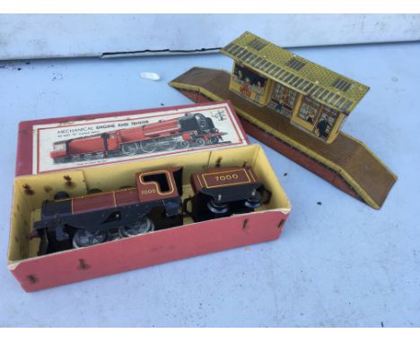 O gauge boxed tinplate, clockwork, Engine and Tender, with a tinplate station