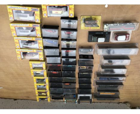 A collection of boxed 1:76 scale, OO gauge, diecast vehicles and N gauge scale models of trains