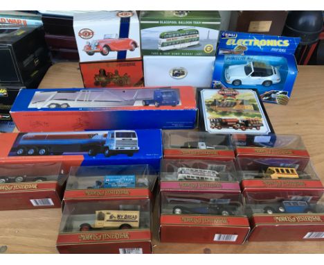 A collection of boxed diecast vehicles including Dinky, Matchbox models of yesteryear, Trams , Esso car transporter and an Es