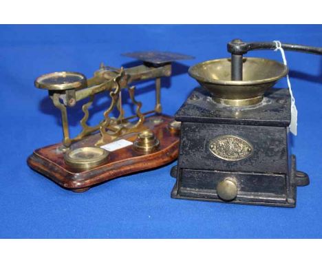 ATTRACTIVE BRASS POSTAL SCALES
together with weights, over a shaped wooden base; together with a Kendrick's Patent coffee mil